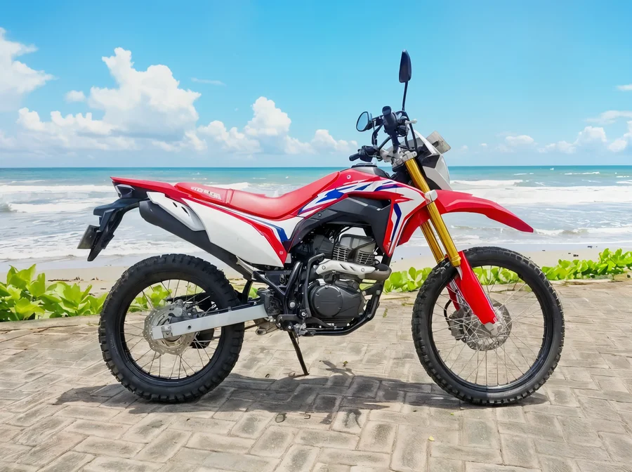 Red Honda CRF150L lightweight dual-sport motorcycle with tall suspension, spoked wheels and trail-oriented tyres