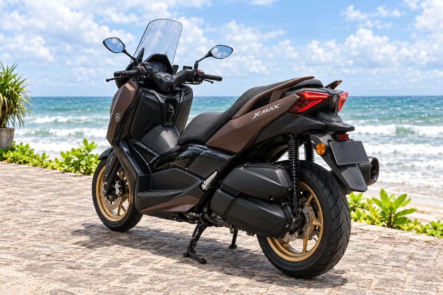 Bronze Yamaha XMAX 250 TECH MAX with gold wheels, front three-quarter view